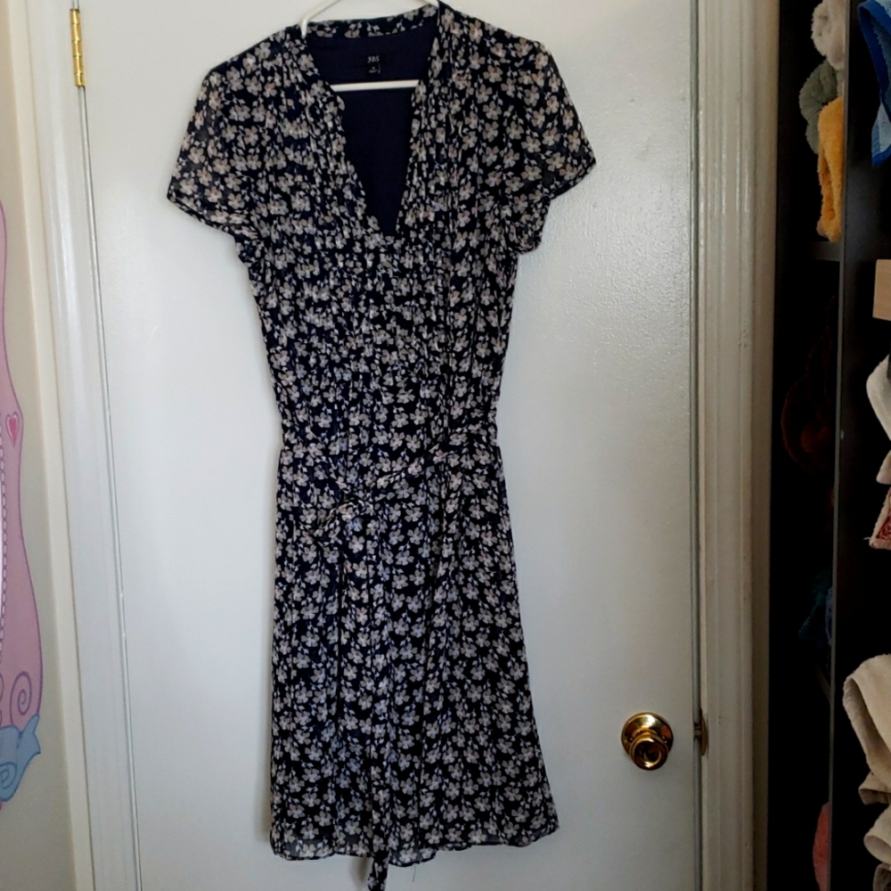J.B.S. Navy blue floral dress with belt is sheer with a navy blue lining.